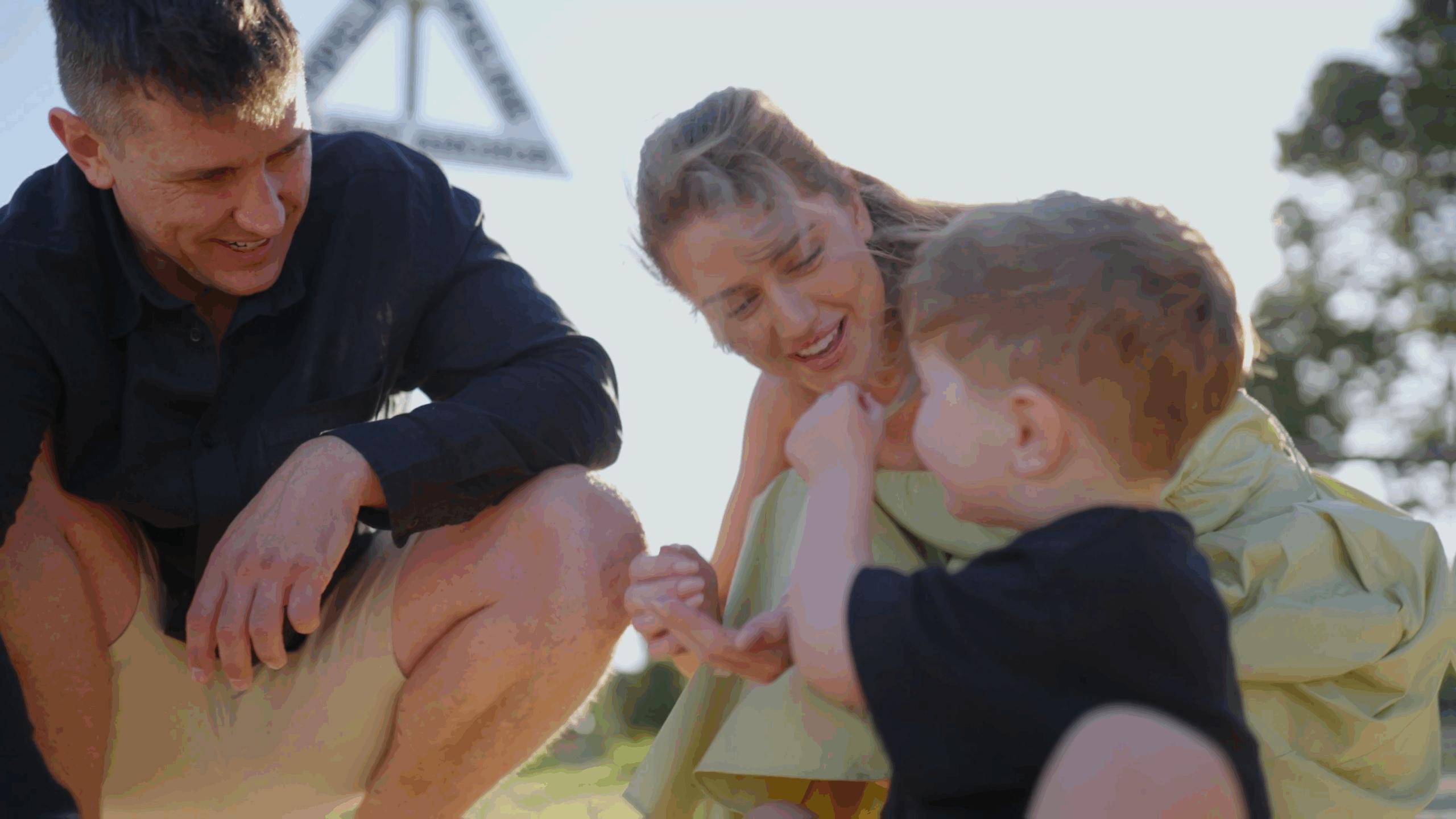 Young family celebrating the purchase of their first home